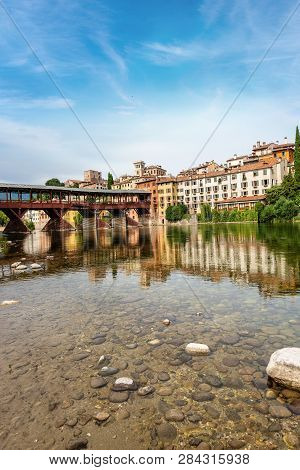 The Old Town Of Bassano Del Grappa With The River Brenta And The Ponte Degli Alpini Or Ponte Vecchio