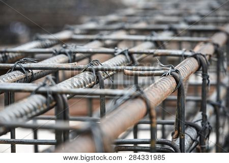 Rebars For Reinforcement Concrete Structure In The Construction Site. And Rusty Surface On Steel