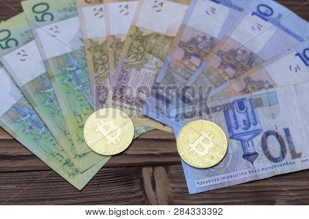 Cryptocurrency, Bitcoins, Paper Of The Belarusian Ruble. Metal Coins Are Laid Out On A Flat Backgrou