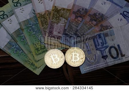 Cryptocurrency, Bitcoins, Paper Of The Belarusian Ruble. Metal Coins Are Laid Out On A Flat Backgrou
