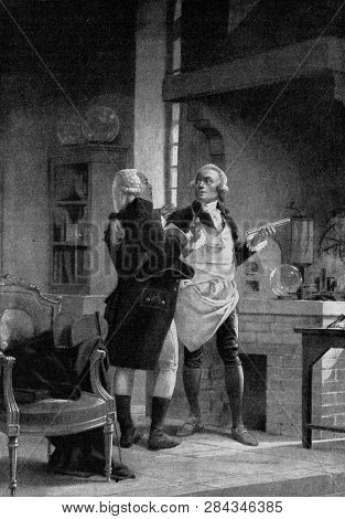 Berthollet visiting Lavoisier at the Sorbonne laboratory, vintage engraved illustration. From the Universe and Humanity, 1910.