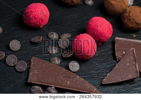 Theme Sweet Dessert Cake Handmade. Macro Close-up Dessert Sweet Candy Round Ball Truffle Set Of Blac