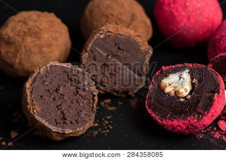 Theme Sweet Dessert Cake Handmade. Macro Close-up Dessert Sweet Candy Round Ball Truffle Set Of Blac