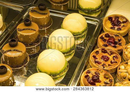 Multi-colored, Different And Tasty Cakes On A Show-window In Cafe. For Every Taste. Big Assortimt Sw