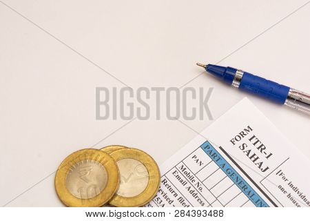 Indian Individual Income Tax Form Itr-1 With Indian Coins On Isolated Background.