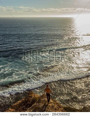 Jung Women Standing On Cliffs Near Port Lincon At Sunset, South Australia