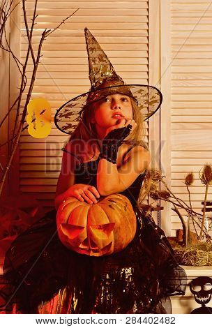 Little Girl Play Childhood Games On Halloween. Early Childhood. Little Girl With Halloween Pumpkin. 