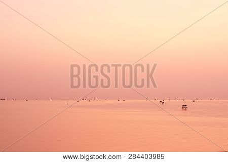 Beautiful Clear Pink Sky Over The Ocean During Sunrise And Villages Of Fishermen In The Sea