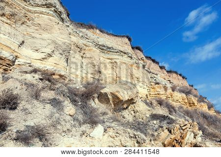 Rockslide. Mountain Landslide In An Environmentally Hazardous Area. Large Cracks In Earth, Descent O