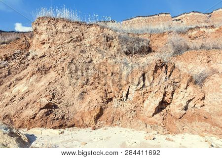 Rockslide. Mountain Landslide In An Environmentally Hazardous Area. Large Cracks In Earth, Descent O