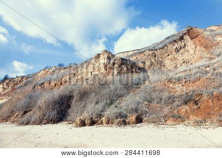 Rockslide. Mountain Landslide In An Environmentally Hazardous Area. Large Cracks In Earth, Descent O