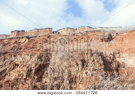 Rockslide. Mountain Landslide In An Environmentally Hazardous Area. Large Cracks In Earth, Descent O