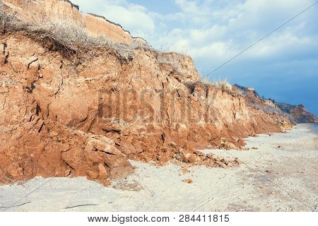 Rockslide. Mountain Landslide In An Environmentally Hazardous Area. Large Cracks In Earth, Descent O