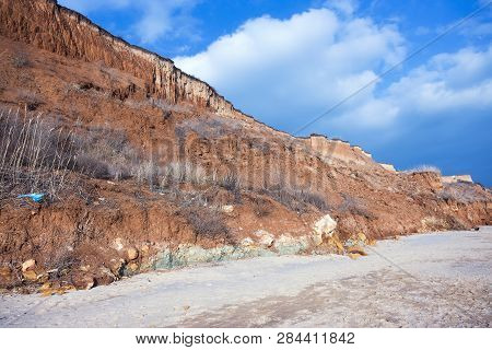 Rockslide. Mountain Landslide In An Environmentally Hazardous Area. Large Cracks In Earth, Descent O