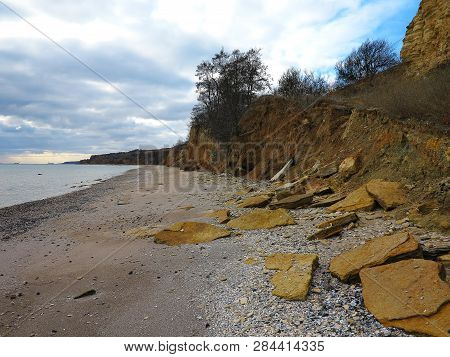 Rockslide. Mountain Landslide In An Environmentally Hazardous Area. Large Cracks In Earth, Descent O