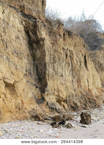 Rockslide. Mountain Landslide In An Environmentally Hazardous Area. Large Cracks In Earth, Descent O