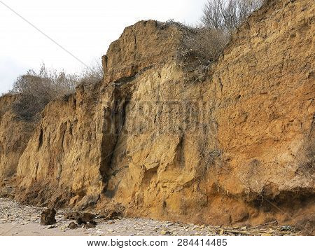 Rockslide. Mountain Landslide In An Environmentally Hazardous Area. Large Cracks In Earth, Descent O
