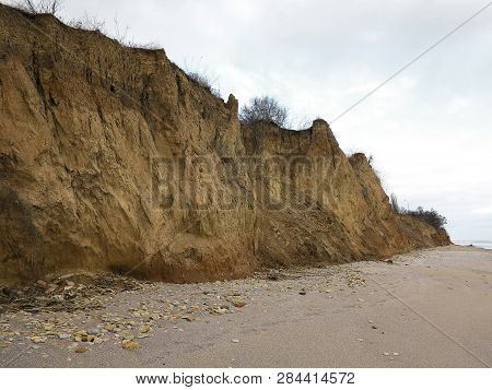 Rockslide. Mountain Landslide In An Environmentally Hazardous Area. Large Cracks In Earth, Descent O