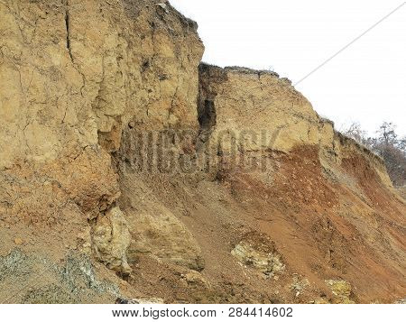 Rockslide. Mountain Landslide In An Environmentally Hazardous Area. Large Cracks In Earth, Descent O