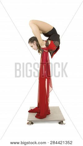 Flexible Equilibrist Performs Exercises On Acrobatic Walking Sticks.