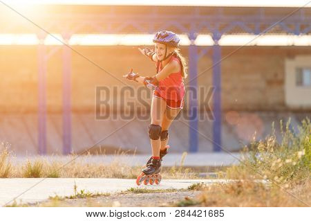 Young Teenage Girl Speed Skating On Rollerdrome
