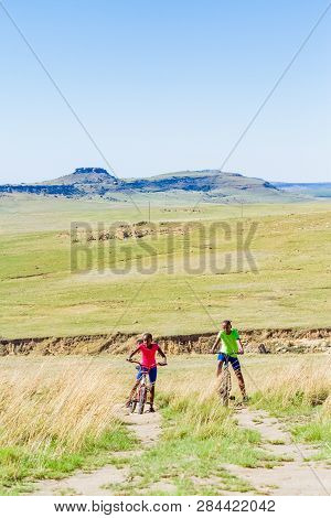 African Children Riding A Bike In Rural A Village