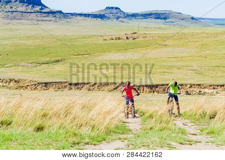 African Children Riding A Bike In Rural A Village