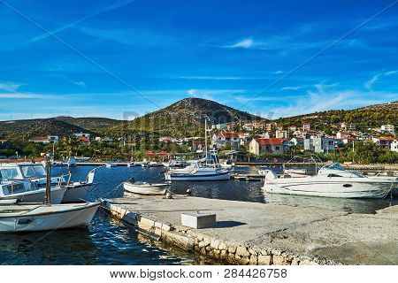 Boats And Sailboats In The Marina In The City Of Seget Vranjica In Croatia
