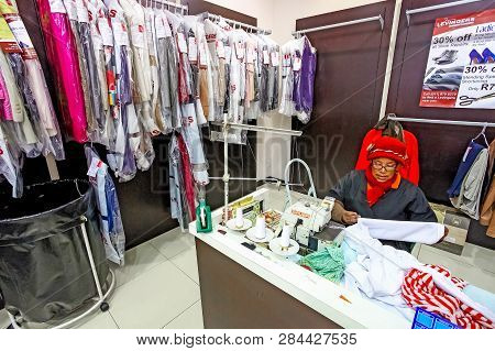 Inside Interior Of A  Dry Cleaners In A Mall