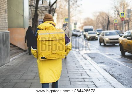 Courier Delievery Guy With Huge Backpack On Foot