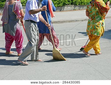 Many Sikh People While Sweeping The Street During The Religious Ceremony