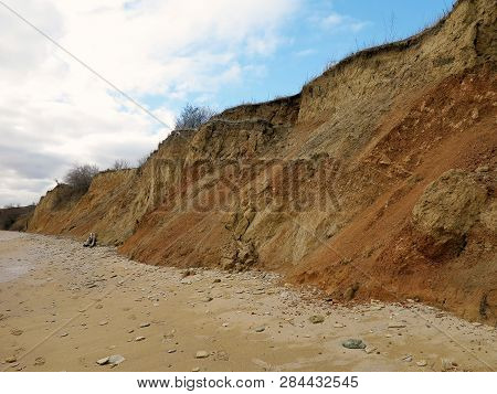 Rockslide. Mountain Landslide In An Environmentally Hazardous Area. Large Cracks In Earth, Descent O