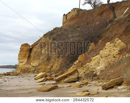 Rockslide. Mountain Landslide In An Environmentally Hazardous Area. Large Cracks In Earth, Descent O