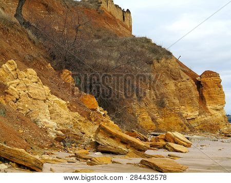 Rockslide. Mountain Landslide In An Environmentally Hazardous Area. Large Cracks In Earth, Descent O