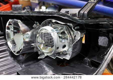 Macro View Of Repairing, Installation And Tuning Headlight Of Modern Automobile And Car Projector Le