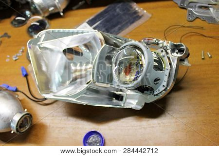 Macro View Of Repairing, Installation And Tuning Headlight Of Modern Automobile And Car Projector Le