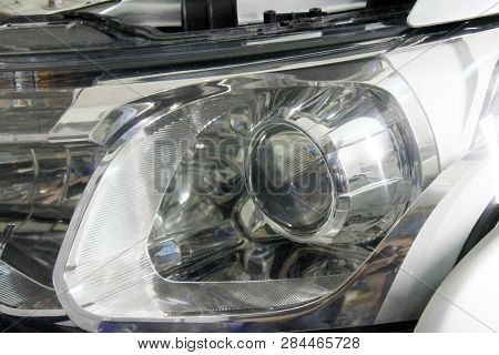 Macro View Of Repairing, Installation And Tuning Headlight Of Modern Automobile And Car Projector Le