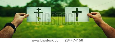 Religion Conflicts As Global Issue Concept. Two Hands Holding Different Christianity Cross Symbols, 