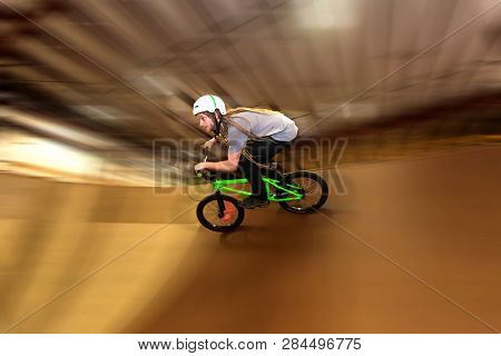 Man Jumping And Riding On A Bmx Bicycle At An Extreme Sports Park