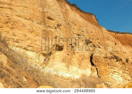 Rockslide. Mountain Landslide In An Environmentally Hazardous Area. Large Cracks In Earth, Descent O