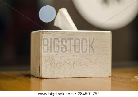A Wooden Box Of White Napkins On The Table. Tissues Close Up View.