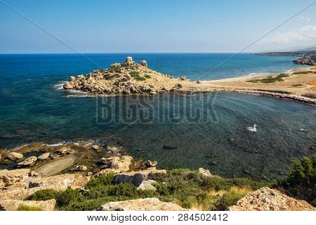 Small Alagadi Beach Panorama With Peninsula And Dry Pasture