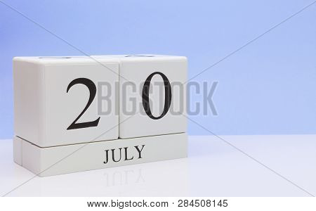 July 20st. Day 20 Of Month, Daily Calendar On White Table With Reflection, With Light Blue Backgroun