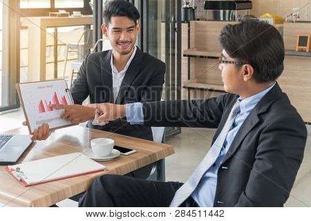 Young Businessman Is Presented Investment Chart To The Business Owner. The Boss To Point Fingers At 