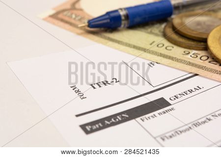 New Indian Taxation From Itr-2 Income Tax Form With Indian Currency On Isolated Background