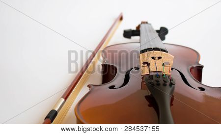 Violin Or Viola With Bow In White Background. Fiddle In White Background