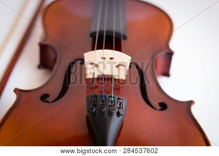 Violin with bow in white background or fiddle in white background