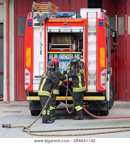 Vicenza, Vi, Italy - May 10, 2018: Fire Truck And Talian Firefighters With Uniform During Fire Drill