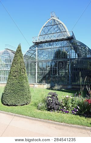 Ancient Glass And Steel Greenhouse In The Public Park In Lyon In The Parck Called Park Of The Golden