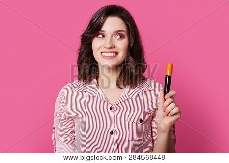 Darkeyed Teen Model With Trendy Shirt Print Posing On Stylish Isolated Pink Background With Mascara,